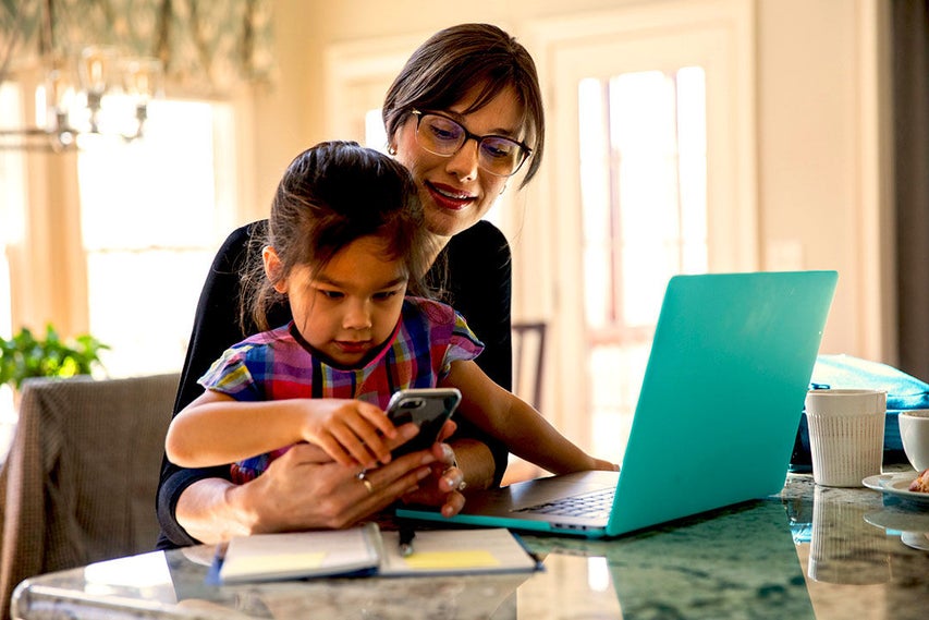 woman and child at laptop