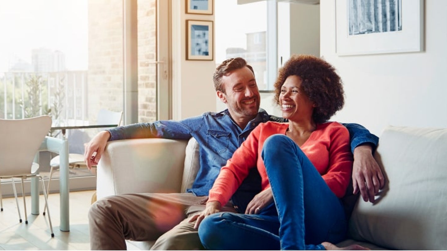 Couple sitting on sofa