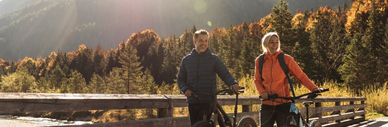 Couple riding bikes on a trail