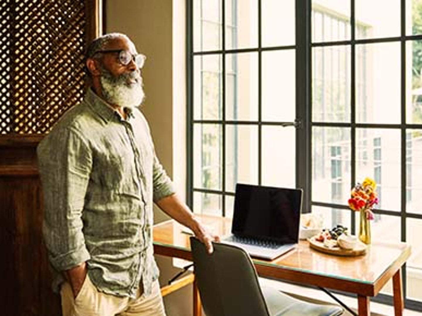 man standing by window