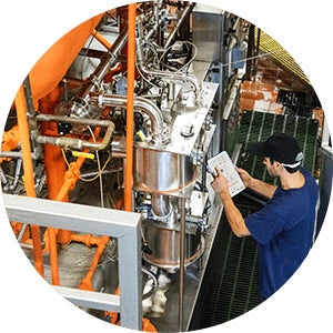 Man looking at factory equipment