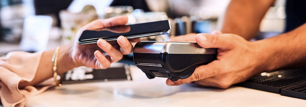 Woman using tap to pay