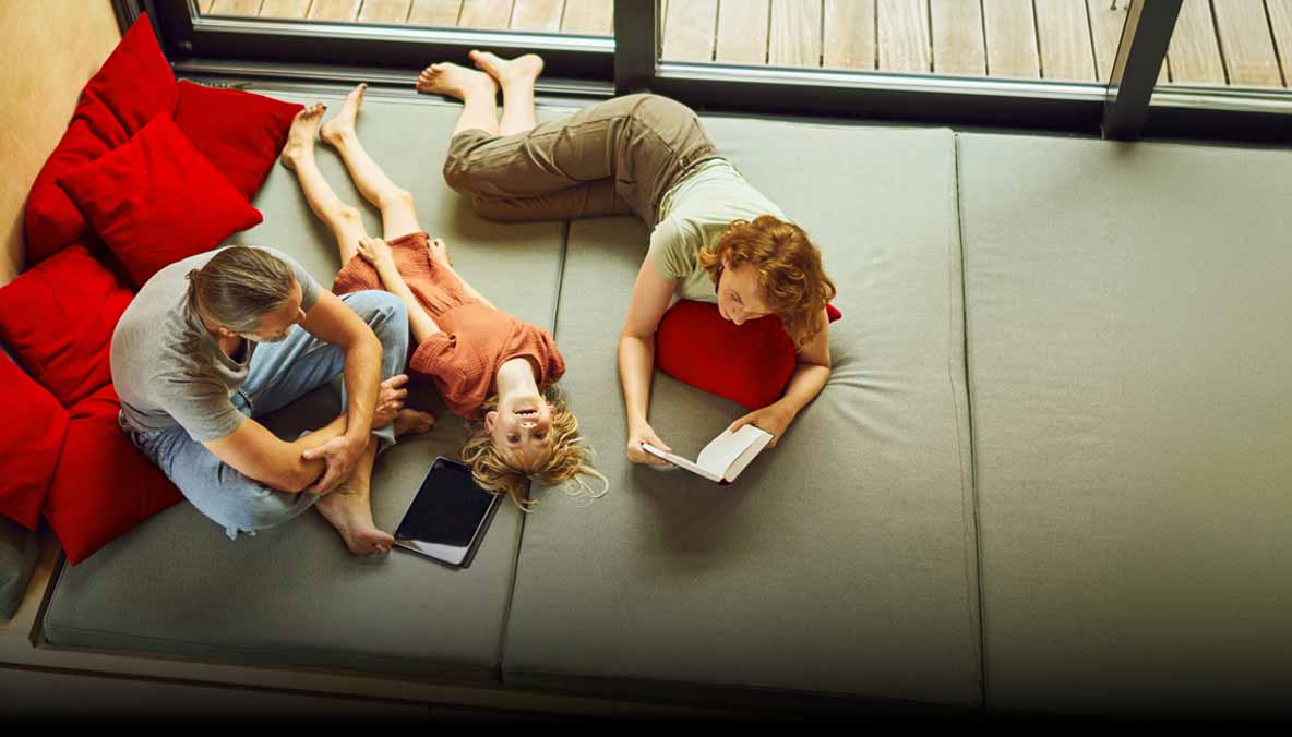 Family lounging on cushions