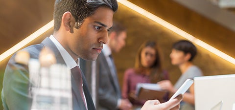 man looking at mobile device
