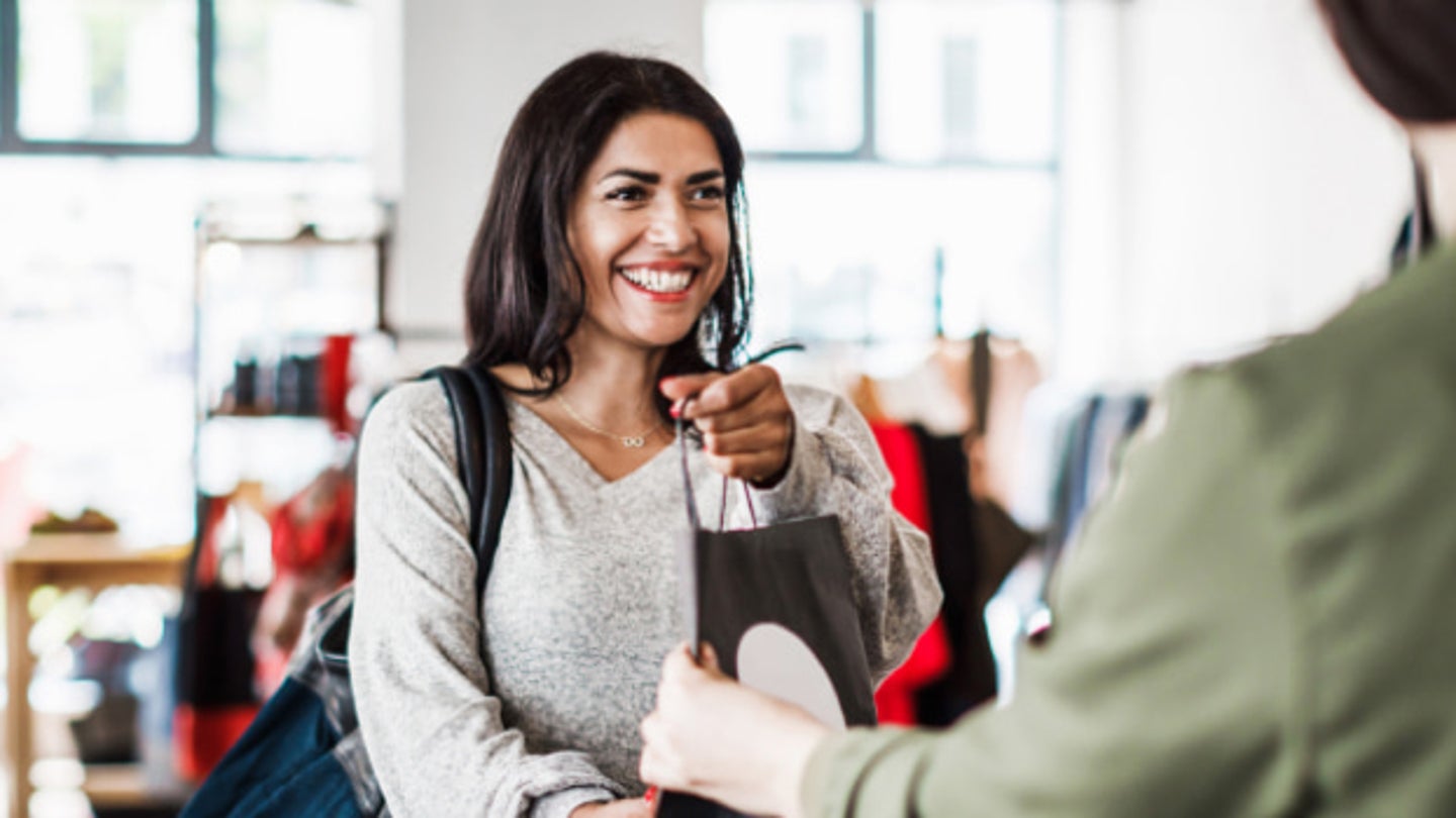 Woman being handed a bag