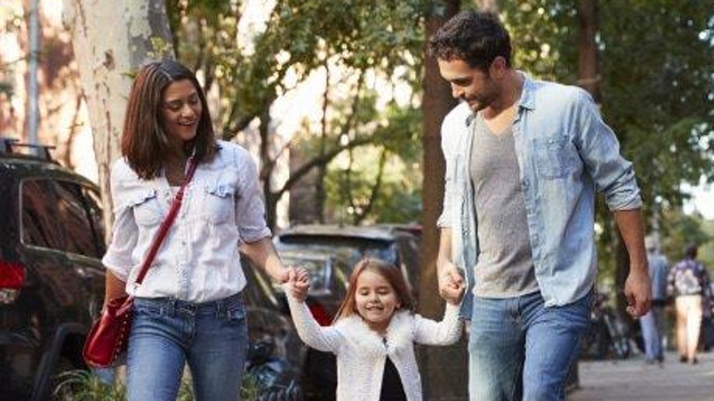 Couple walking with child