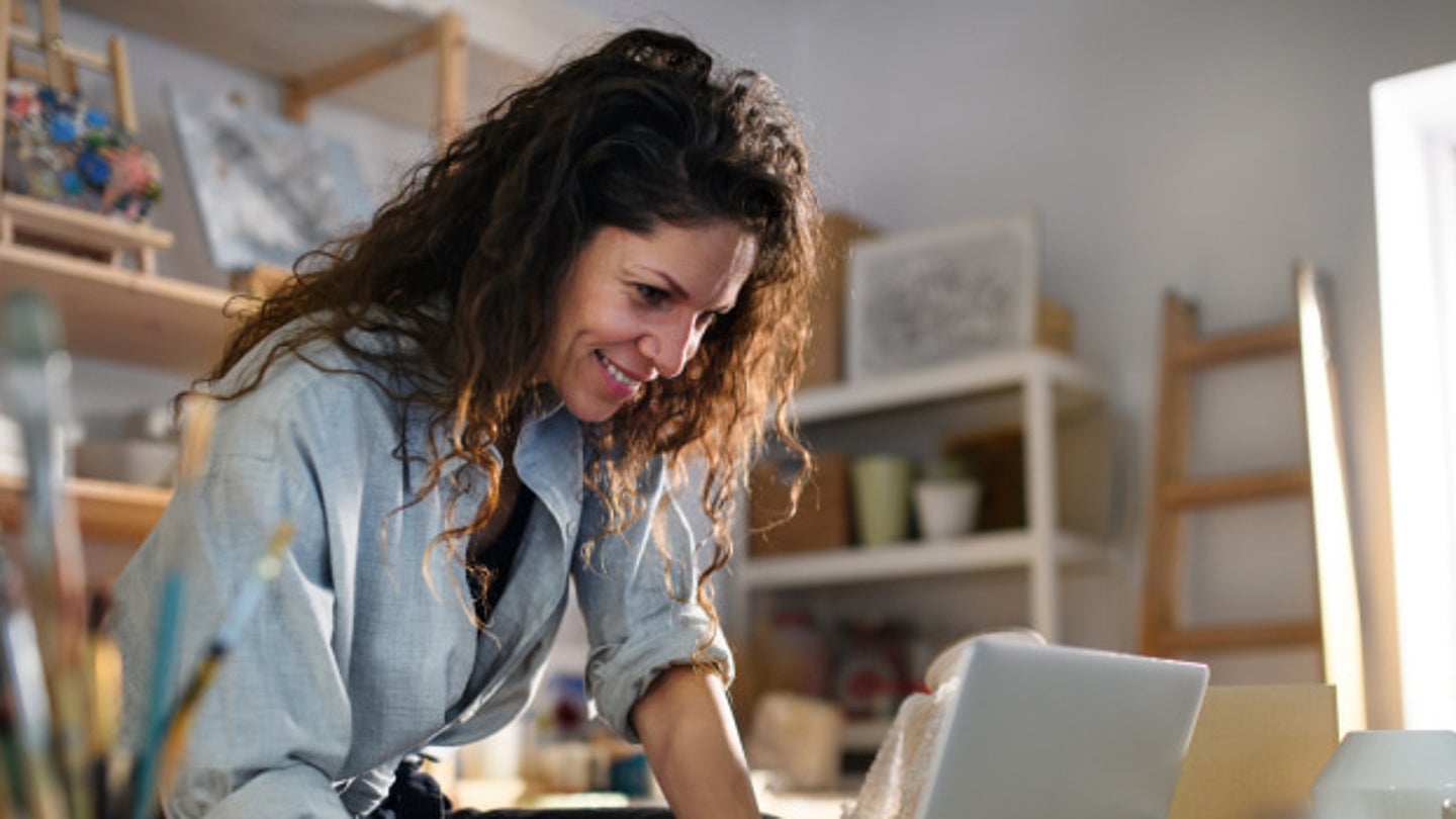 woman looking at laptop